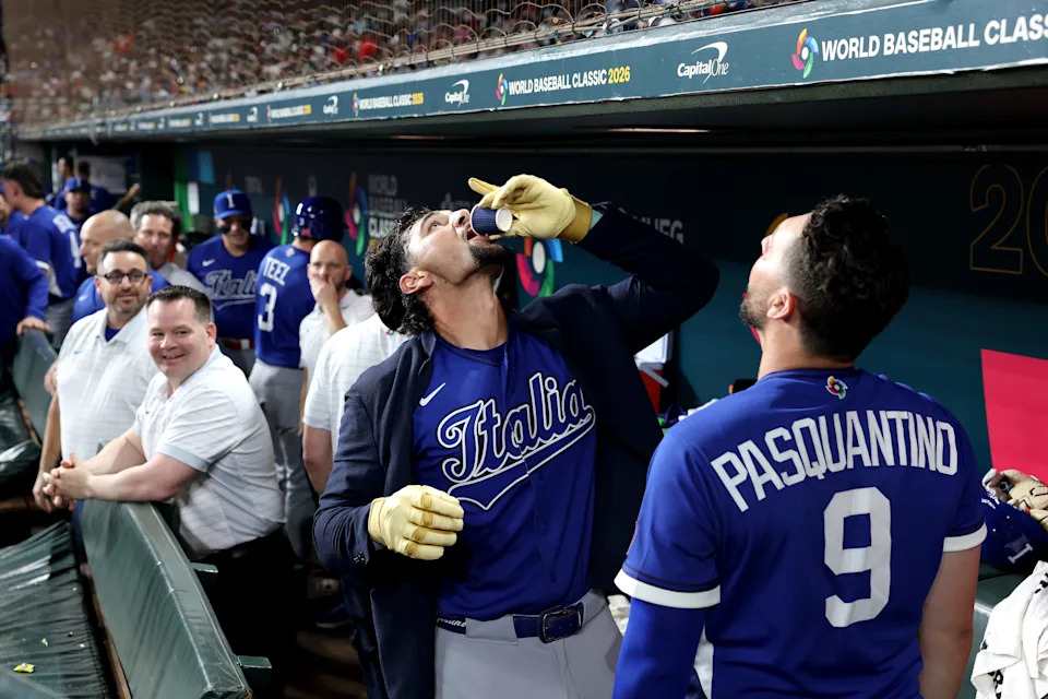 Italy's Jac Caglianone celebrates a home run with teammate Vinnie Pasquantino by drinking espresso during the 2026 World Baseball Classic.