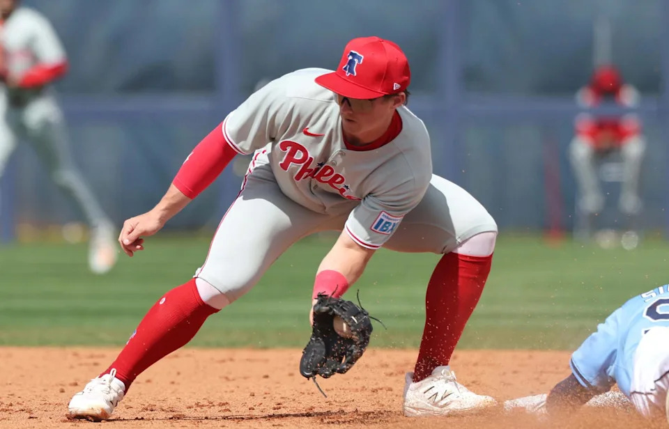 Feb 25, 2025; Port Charlotte, Florida, USA; Tampa Bay Rays outfielder Chandler Simpson (96) slides safely into second base against Philadelphia Phillies infielder Aidan Miller (81) at Charlotte Sports Park. Mandatory Credit: Kim Klement Neitzel-Imagn Images