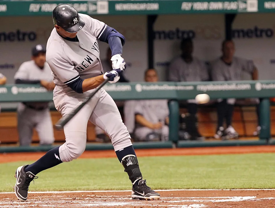 New York Yankees third baseman Alex Rodriguez hits a double.