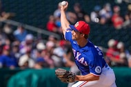 Texas Rangers pitcher Carter Baumler delivers during the third inning of a spring training...