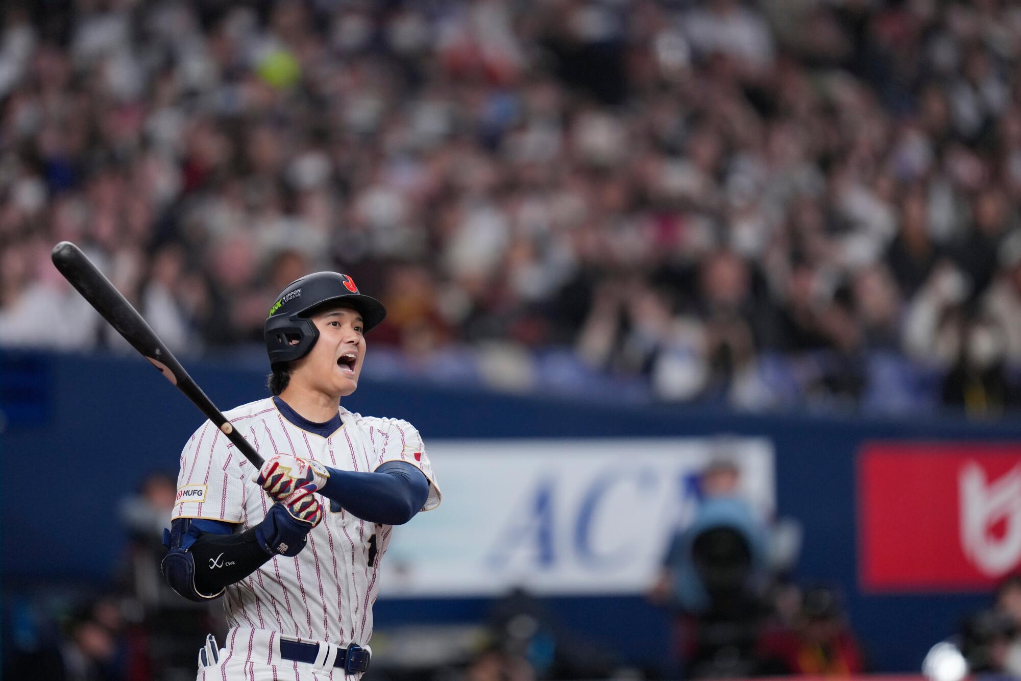 Japan's Shohei Ohtani reacts after taking a swing during an exhibition game against the Orix Buffaloes on Monday.