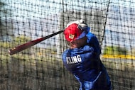 Texas Rangers minor league outfielder Paxton Kling hits in a batting cage during a spring...