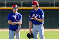 Texas Rangers pitcher Jacob Degrom (right) laughs with manager Skip Schumaker during a...