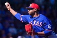 Texas Rangers pitcher Kumar Rocker delivers during the first inning of a spring training...
