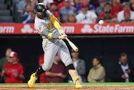 Pittsburgh Pirates' Andrew McCutchen hits a three-run home run during the fourth inning of a...