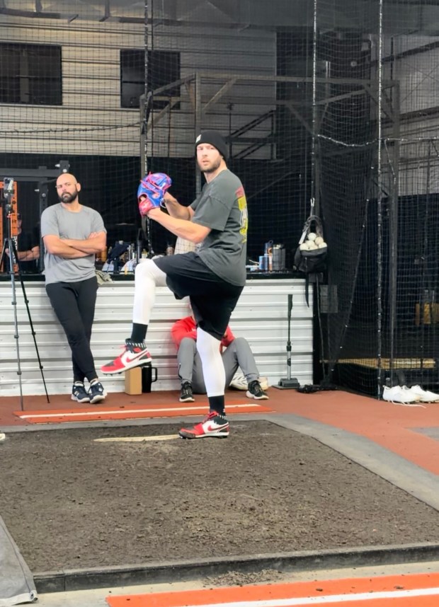 Michael Fulmer (left) watches Adrian Houser, who signed a two-year, $22 million deal with the San Francisco Giants this offseason, throw a bullpen. (Photo courtesy of Alex Marney)