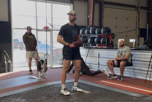 Michael Fulmer (right) watches Miami Marlins top prospect Thomas White (center) throw a bullpen (Photo courtesy of Alex Marney)
