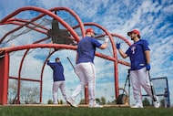 Texas Rangers infielder Josh Smith (right) gets a hand from first baseman Jake Burger after...