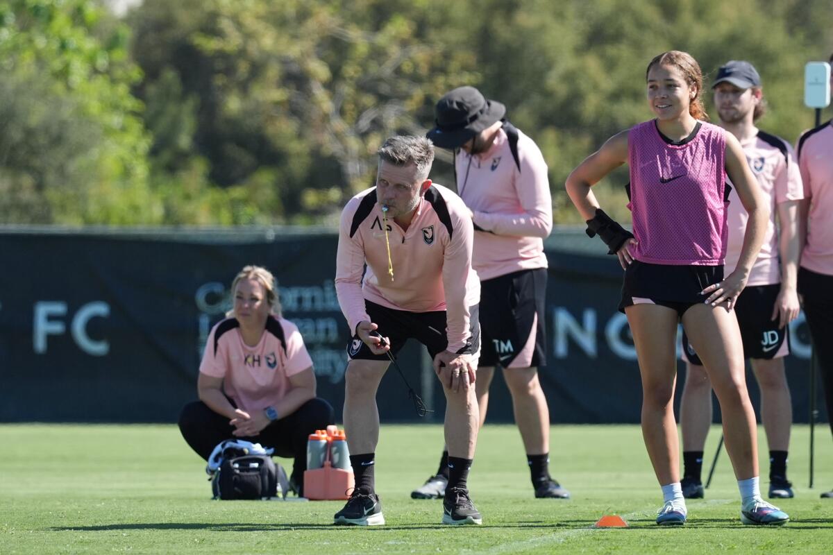 Angel City coach Alexander Straus watches over a practice session at the team's training facility.
