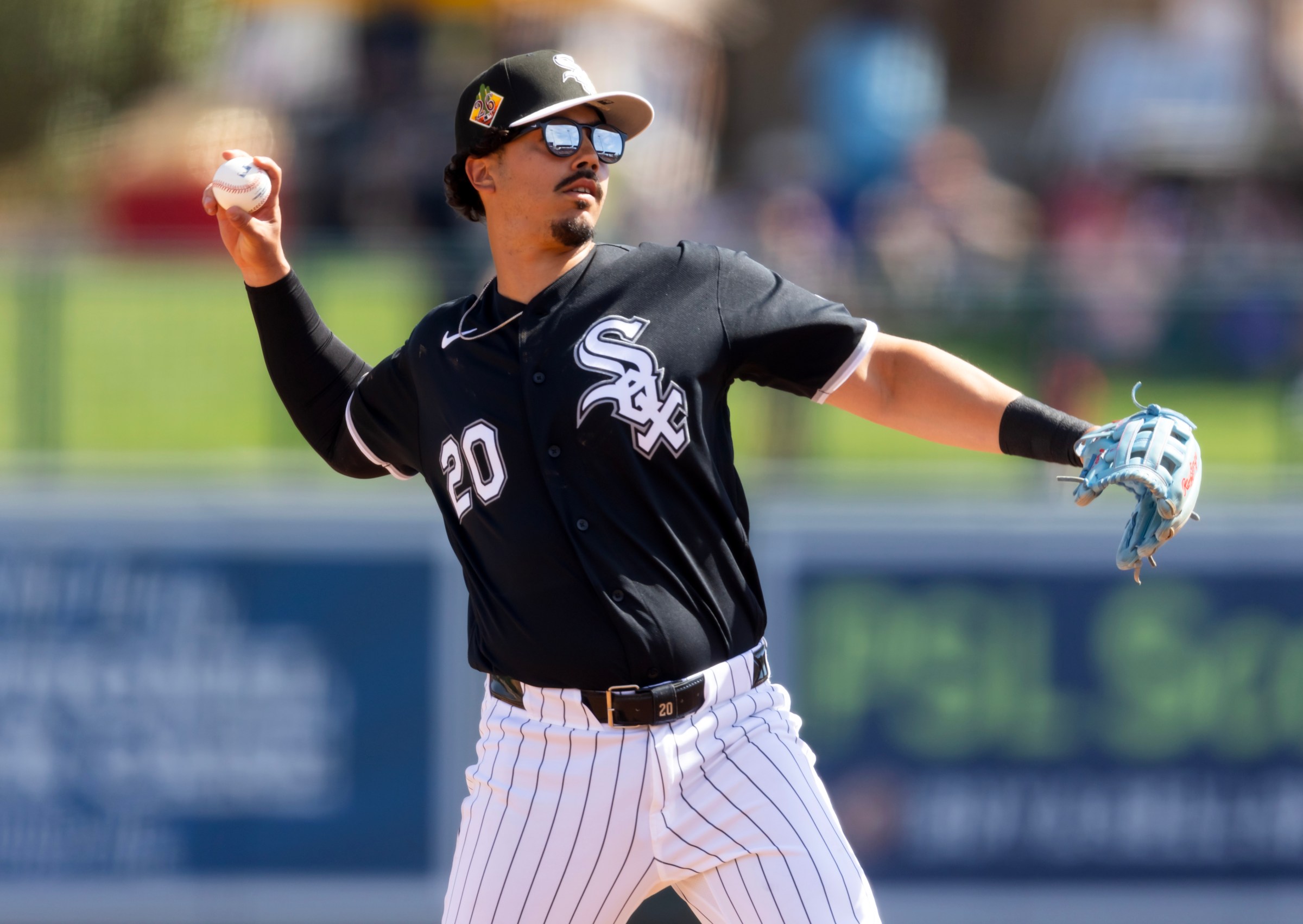 Miguel Vargas throwing a ball.
