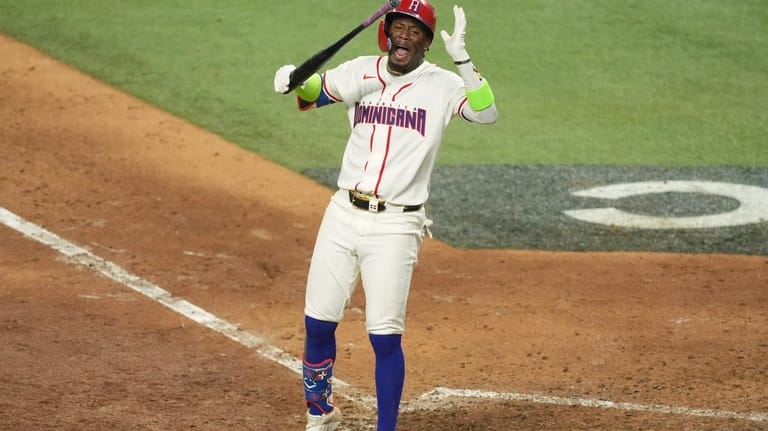 Dominican Republic Geraldo Perdomo reacts after striking out at the...