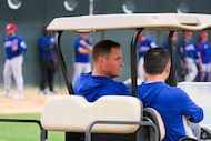 Texas Rangers president of baseball operations, Chris Young watches pitchers work in the...