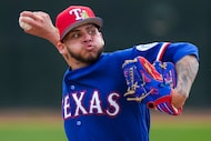 Texas Rangers pitcher David Davalillo throws live batting practice during a spring training...