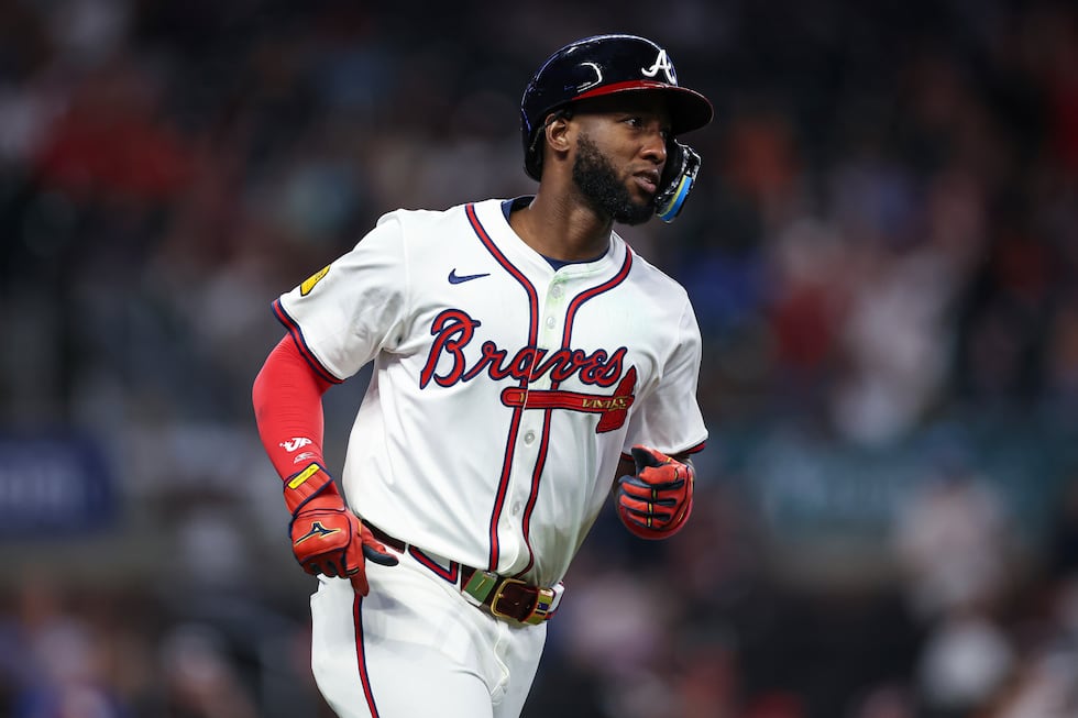 Atlanta Braves' Jurickson Profar rounds first base after hitting a solo home run in the ninth...