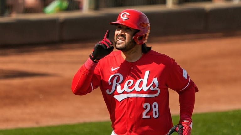 Cincinnati Reds' Eugenio Suárez celebrates his home run against the...