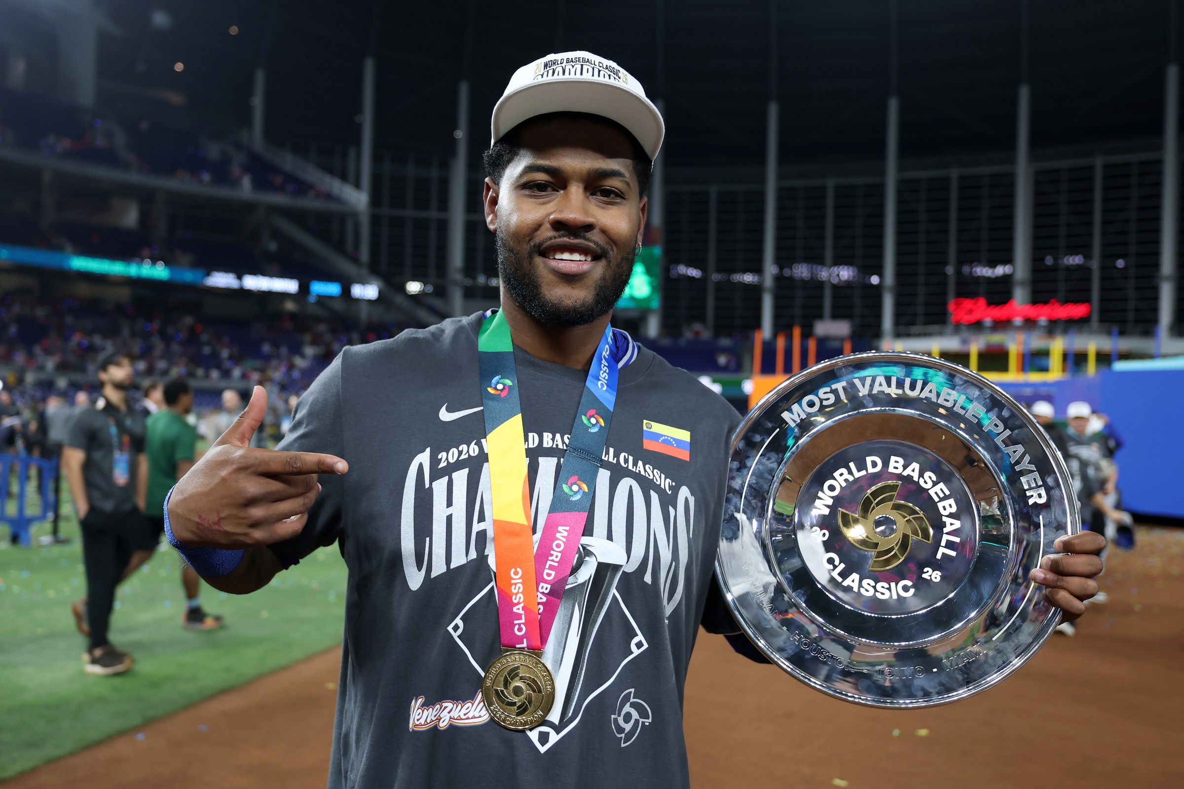 MIAMI, FLORIDA - MARCH 17: Maikel Garcia #11 of Team Venezuela poses with the MVP trophy after the 3-2 victory against Team United States at loanDepot park on March 17, 2026 in Miami, Florida. (Photo by Al Bello/Getty Images)