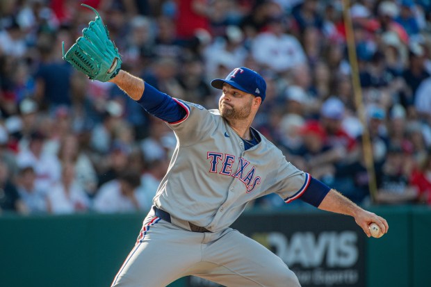 Texas Rangers relief pitcher Danny Coulombe delivers against the Cleveland Guardians during a baseball game, Sunday, Sept. 28, 2025, in Cleveland. (AP Photo/Phil Long)