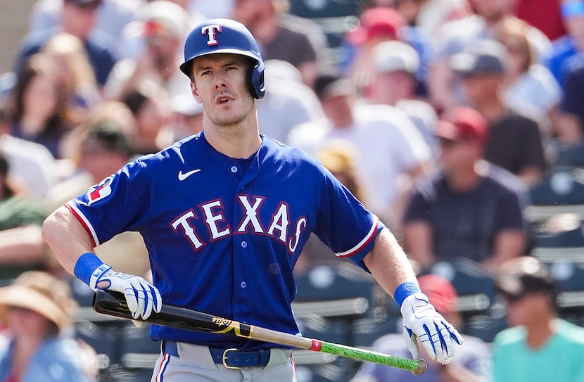 Texas Rangers outfielder Mark Canha steps to the plate during the first inning of a spring...