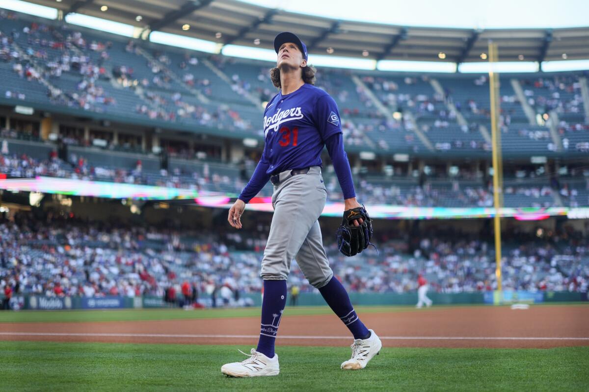 Dodgers pitcher Tyler Glasnow walks to the dugout before starting against the Angels at Angel Stadium on Sunday.