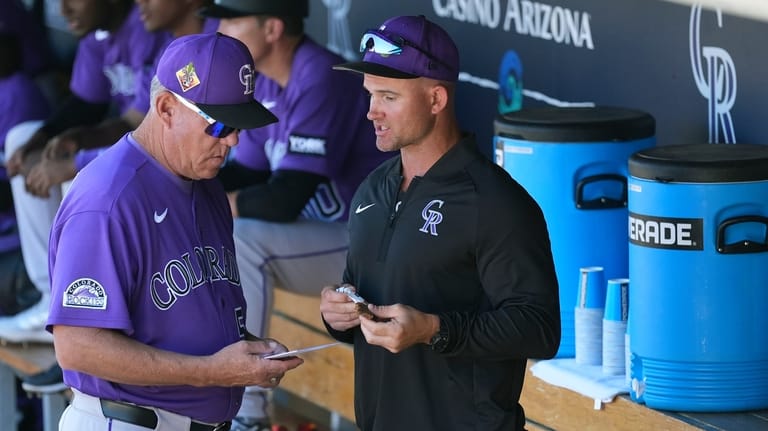 Colorado Rockies manager Warren Schaeffer, right, talks with Rockies assistant...