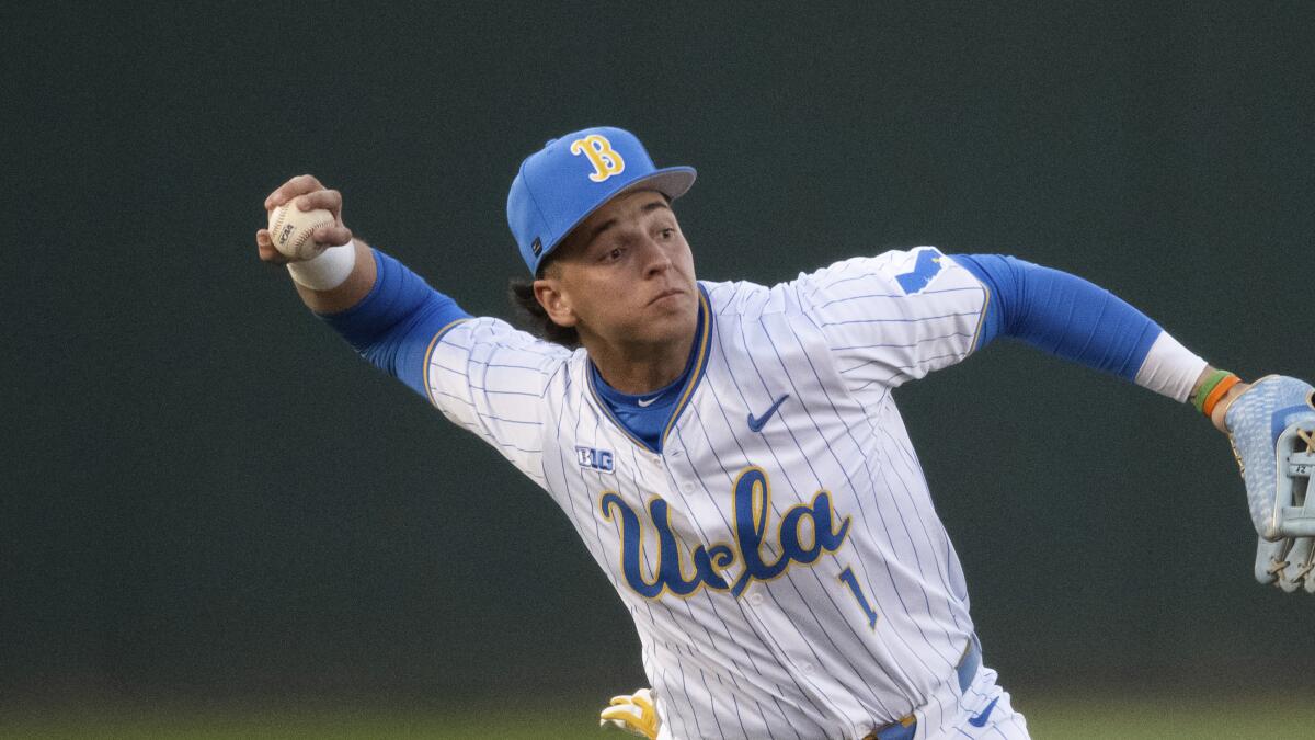 UCLA shortstop Roch Cholowsky throws the ball during a game against BYU on Feb. 18 in Los Angeles. 