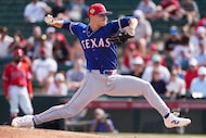 Texas Rangers pitcher Jack Leiter delivers during the first inning of a spring training game...