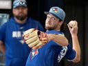 Toronto Blue Jays pitcher Trey Yesavage throws a  bullpen session as manager John Schneider watches at Spring Training in Dunedin, Fla. on Wednesday Feb. 11, 2026.