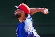 Texas Rangers pitcher Jose Corniell throws in the bullpen during a spring training workout...
