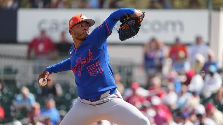 New York Mets starting pitcher Freddy Peralta throws during the...