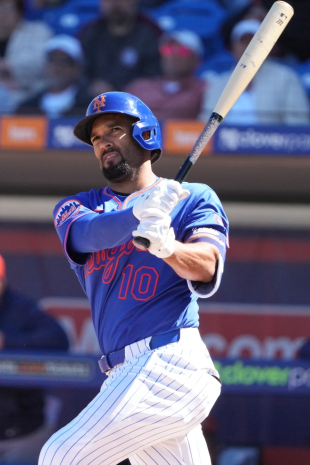 New York Mets' Marcus Semien fouls off a pitch during the first inning of a spring training baseball game against the Houston Astros Tuesday, Feb. 24, 2026, in Port St. Lucie, Fla. (AP Photo/Jeff Roberson)
