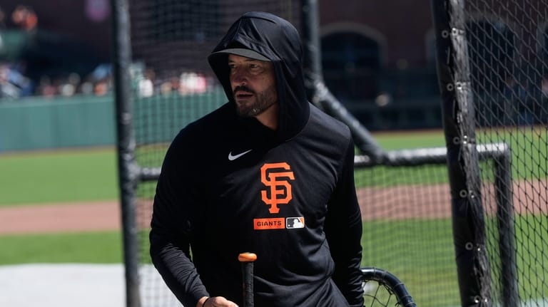 San Francisco Giants manager Tony Vitello walks on the field...