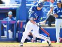Daulton Varsho of the Toronto Blue Jays hits during a spring training game against team Canada.