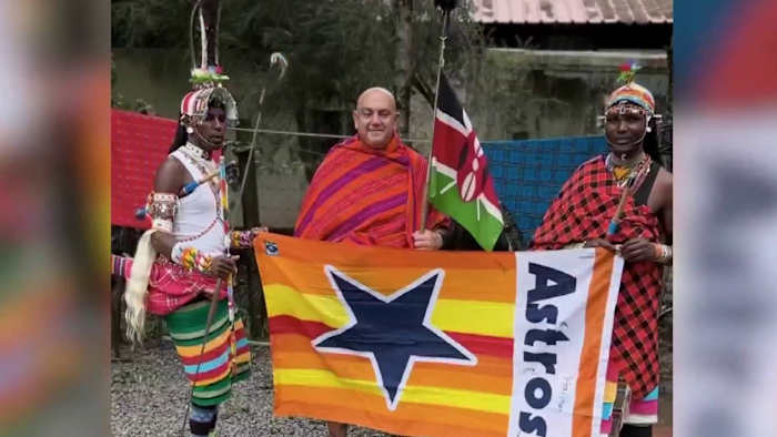 Houston Astros superfan carries team flag across 100 countries, 6 continents