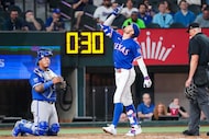 Texas Rangers outfielder Brandon Nimmo celebrates as he touches home after hitting a two-run...