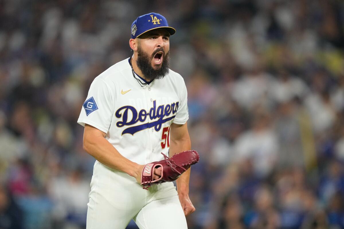 Dodgers relief pitcher Alex Vesia celebrates after pitching in the seventh inning Friday against the Diamondbacks.