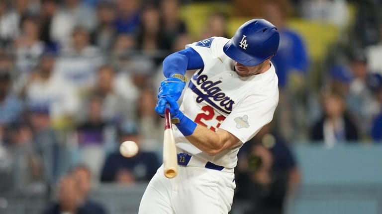 Los Angeles Dodgers' Kyle Tucker hits an RBI single during...