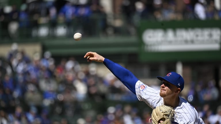Chicago Cubs pitcher Cade Horton (22) delivers during the first...