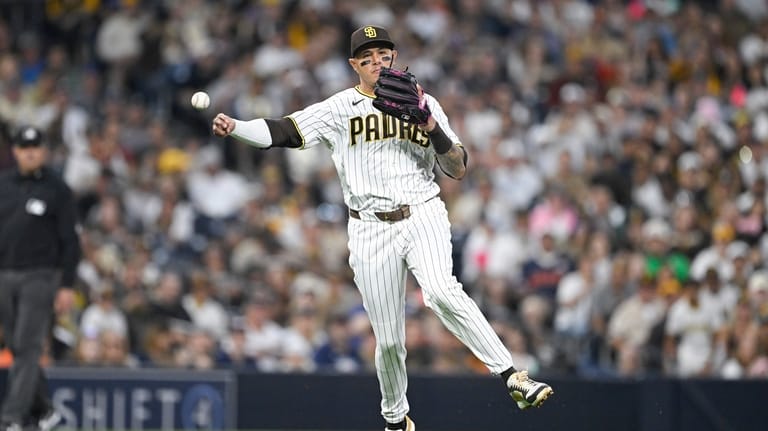 San Diego Padres third baseman Manny Machado throws out Detroit...