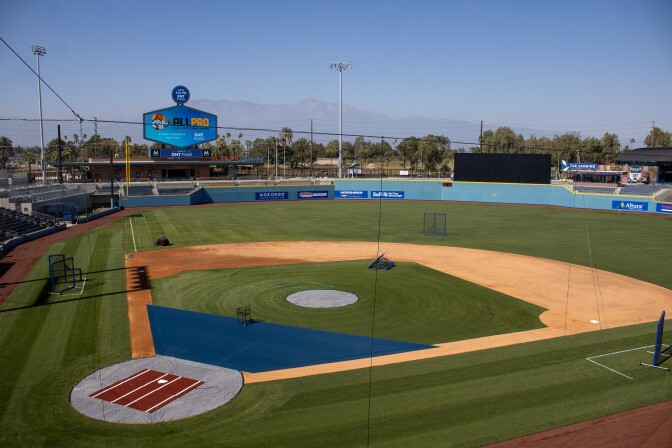 A baseball feld seen from the stands. There are no players on the field.