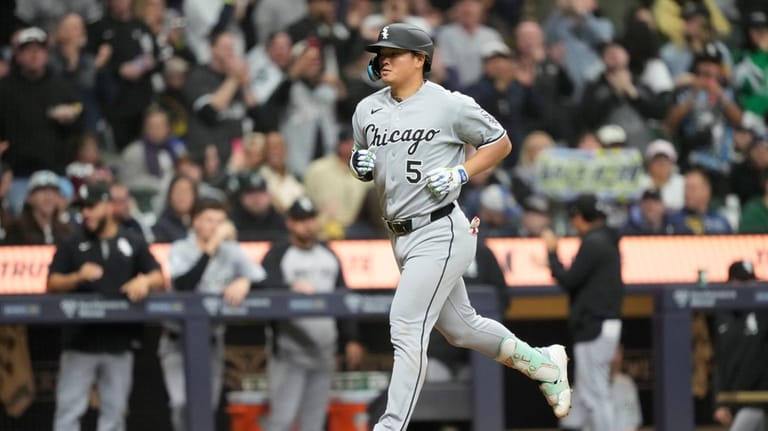 Chicago White Sox's Munetaka Murakami runs the bases after hitting...