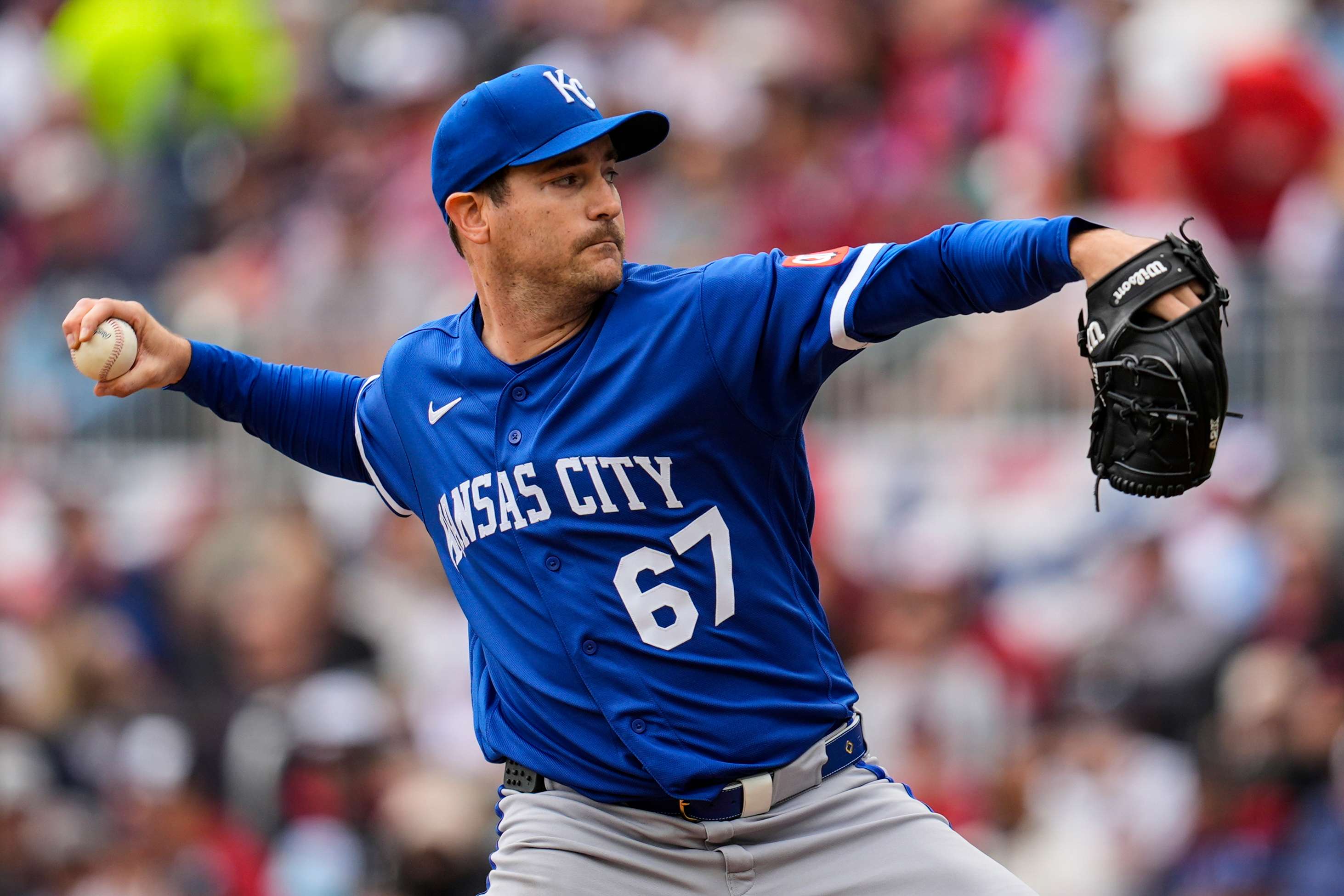 Kansas City Royals pitcher Seth Lugo (67) works against the Atlanta Braves in the first inning of a baseball game, Sunday, March 29, 2026, in Atlanta. (AP Photo/Mike Stewart)
