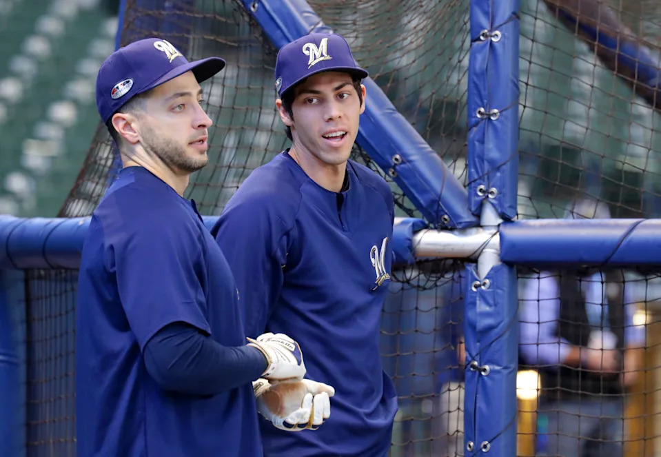 Milwaukee Brewers Ryan Braun (left) and Christian Yelich chat before the Milwaukee Brewers National League Divisional Series game against the Colorado Rockies on Thursday, October 4, 2018.