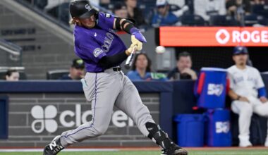 Johnston hits a 2-run homer as the Rockies rout the Blue Jays 14-5 for their 1st win of the season