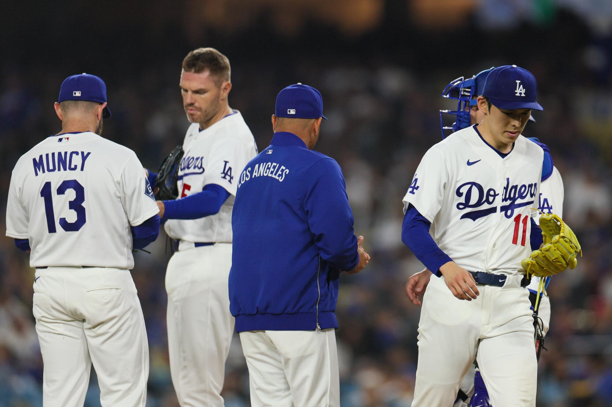 Dodgers manager Dave Roberts removes starting pitcher Roki Sasaki from the game.