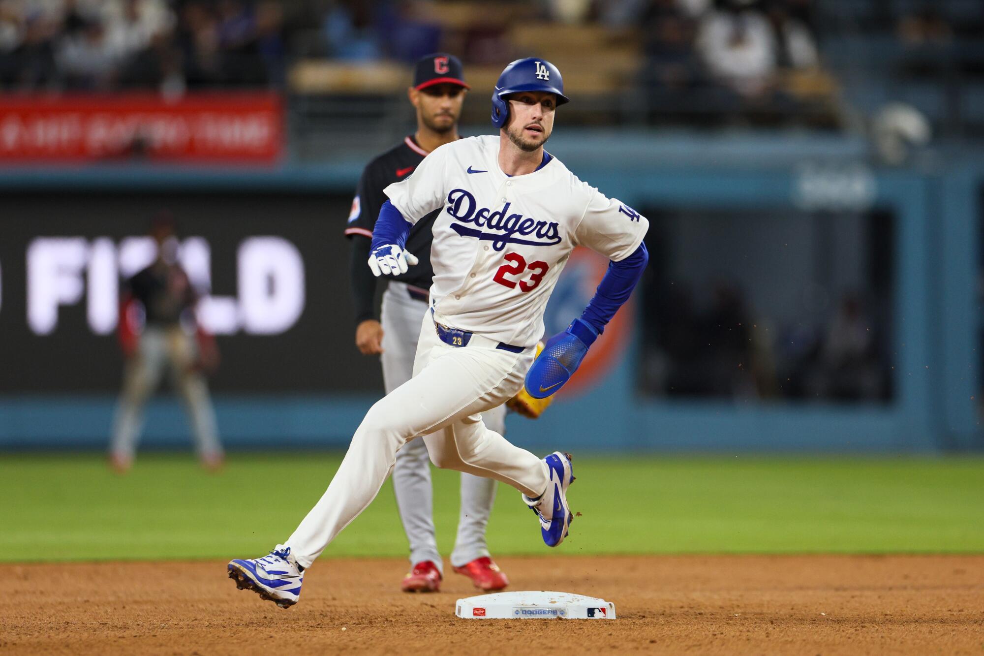 Dodgers outfielder Kyle Tucker rounds second base after a Mookie Betts double during the ninth inning.