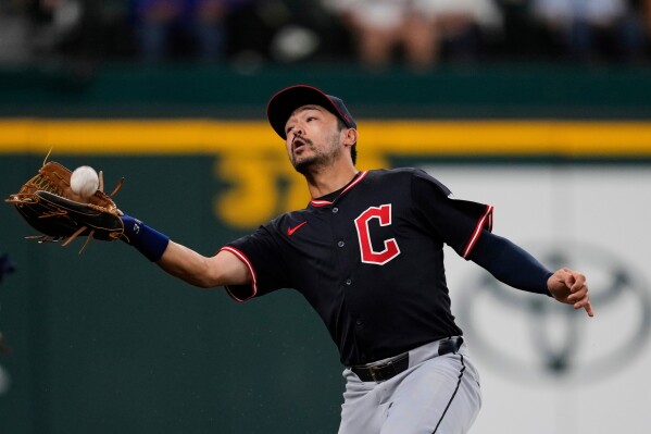 Cleveland Guardians left fielder Steven Kwan reaches out to catch a fly out during a baseball game against the Texas Rangers, Aug. 23, 2025, in Arlington, Texas. (AP Photo/Tony Gutierrez, File)