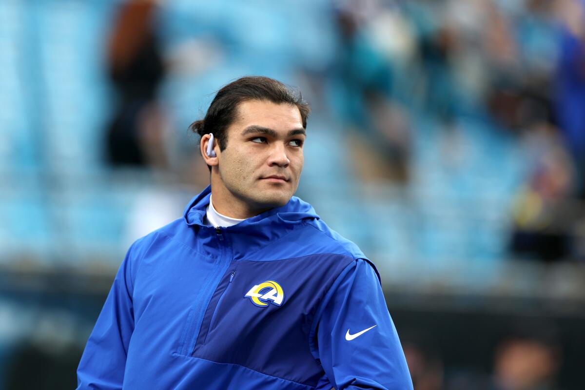 Rams wide receiver Puka Nacua warms up before a wild-card playoff game against the Carolina Panthers.