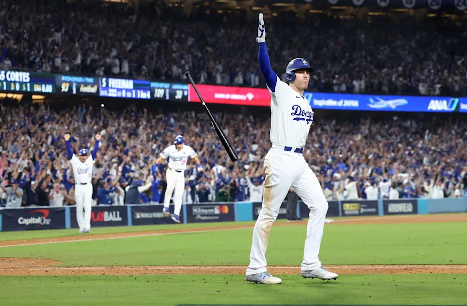 Freddie Freeman tosses his bat after hitting a walk-off grand slam in Game 1 of the 2024 World Series.