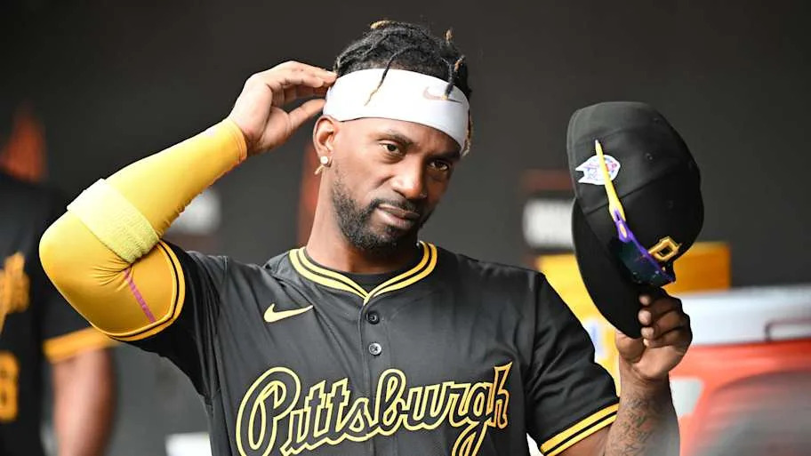 Pittsburgh Pirates designated hitter Andrew McCutchen stands in the dugout.