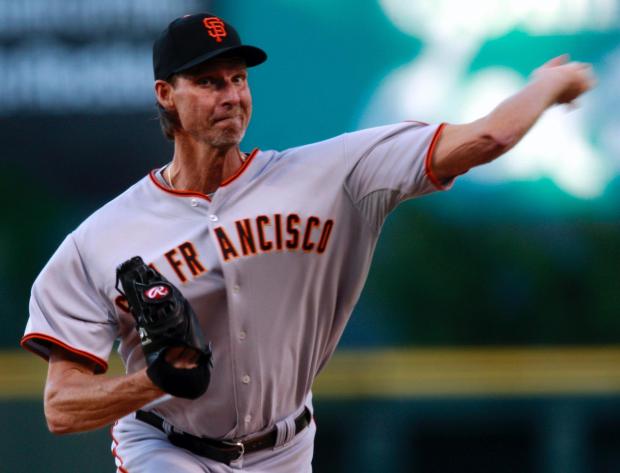 San Francisco Giants starting pitcher Randy Johnson works against the Colorado Rockies in the first inning of a baseball game in Denver on Wednesday, May 6, 2009. (AP Photo/David Zalubowski)